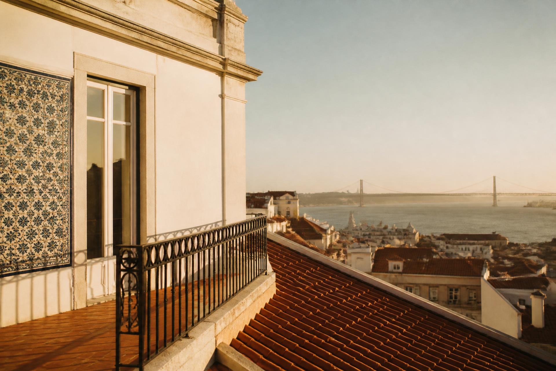 Lisbon rooftop terrace with azulejo tiles and terracotta roofs above the Tagus river